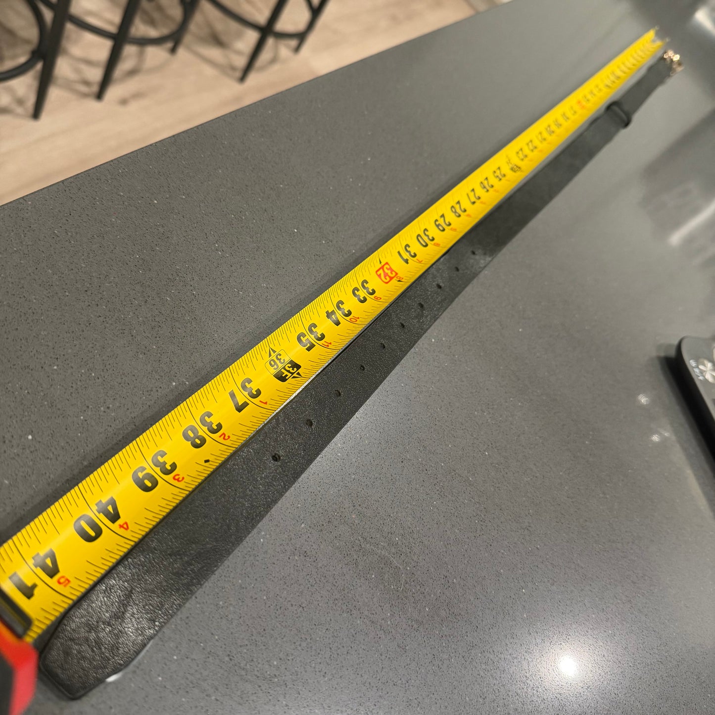 Belt with letter C on it